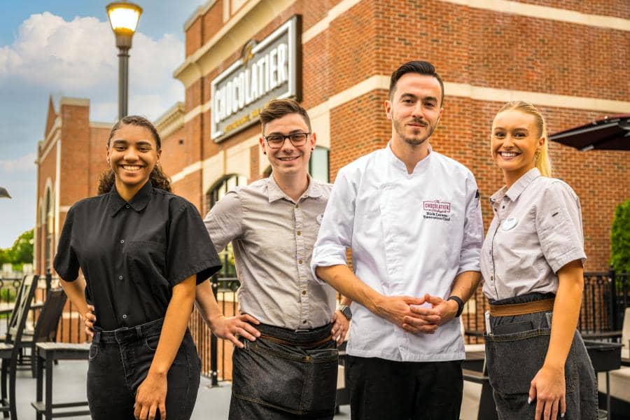 Hersheypark employees gather on the patio of The Chocolatier restaurant