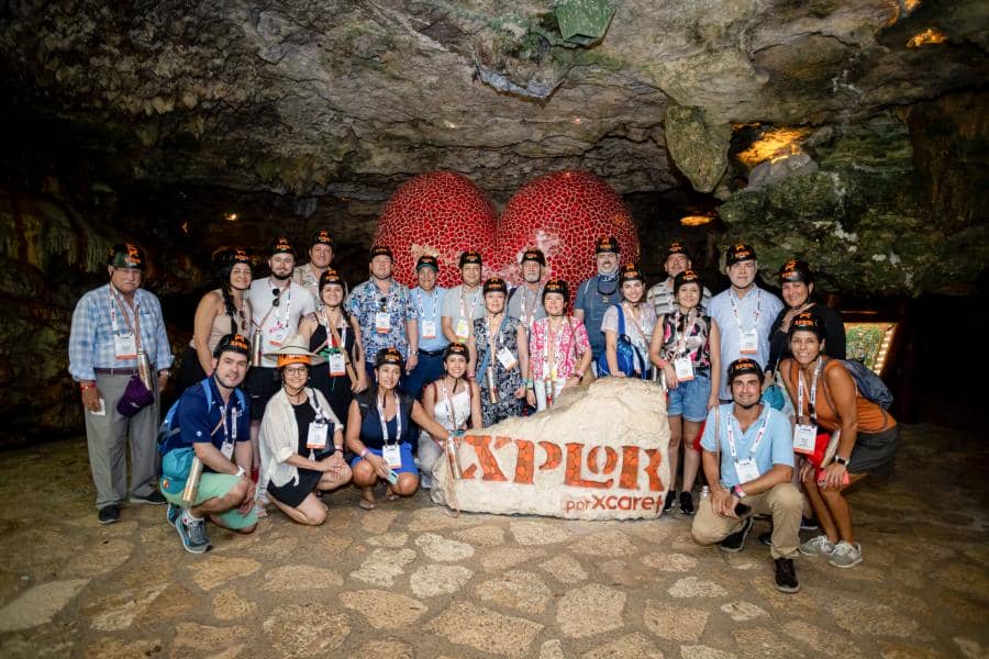 Group photo of IAAPA Latin America and Caribbean members posing inside a cave during IAAPA Explores LAC