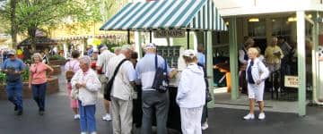 Visitors huddle together in front of the park map station at Dollywood 