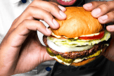 Man eating impossible Burger