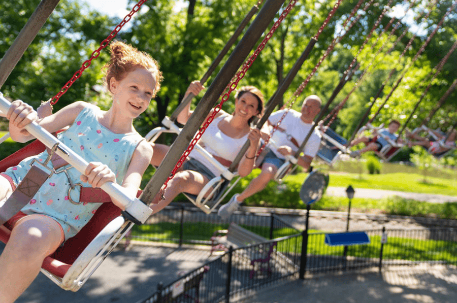 guests riding swinging ride