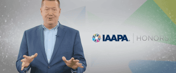 Screenshot of IAAPA Honors announcement, featuring Scott Fais presenting the winners